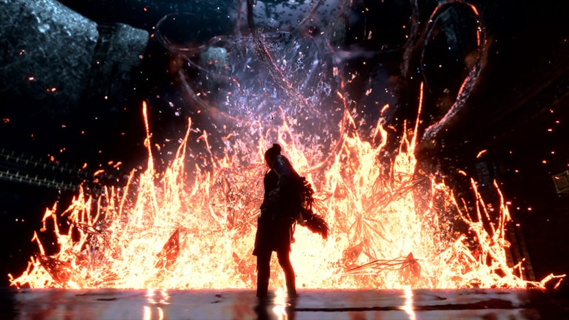 La protagonista de Forspoken junto a una estructura en llamas.
